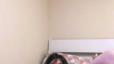 Busty amateur brunette toying herself on web cam