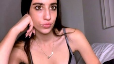 Russian brunette busty camgirl masturbating on webcam